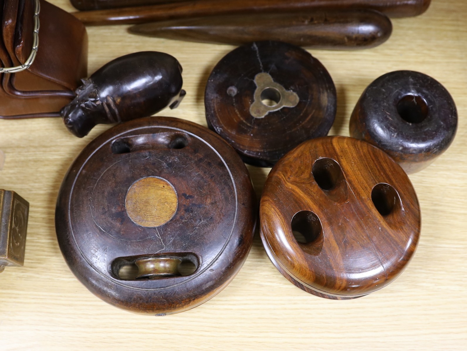 A collection of lignum vitae, rosewood etc. fids, pulley wheels etc